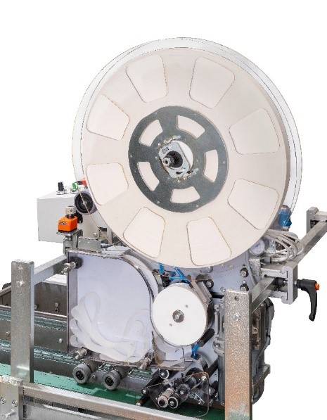 Applicatore di nastro siliconato Macari-Fidia Mistral con la sua bobina di carta siliconata